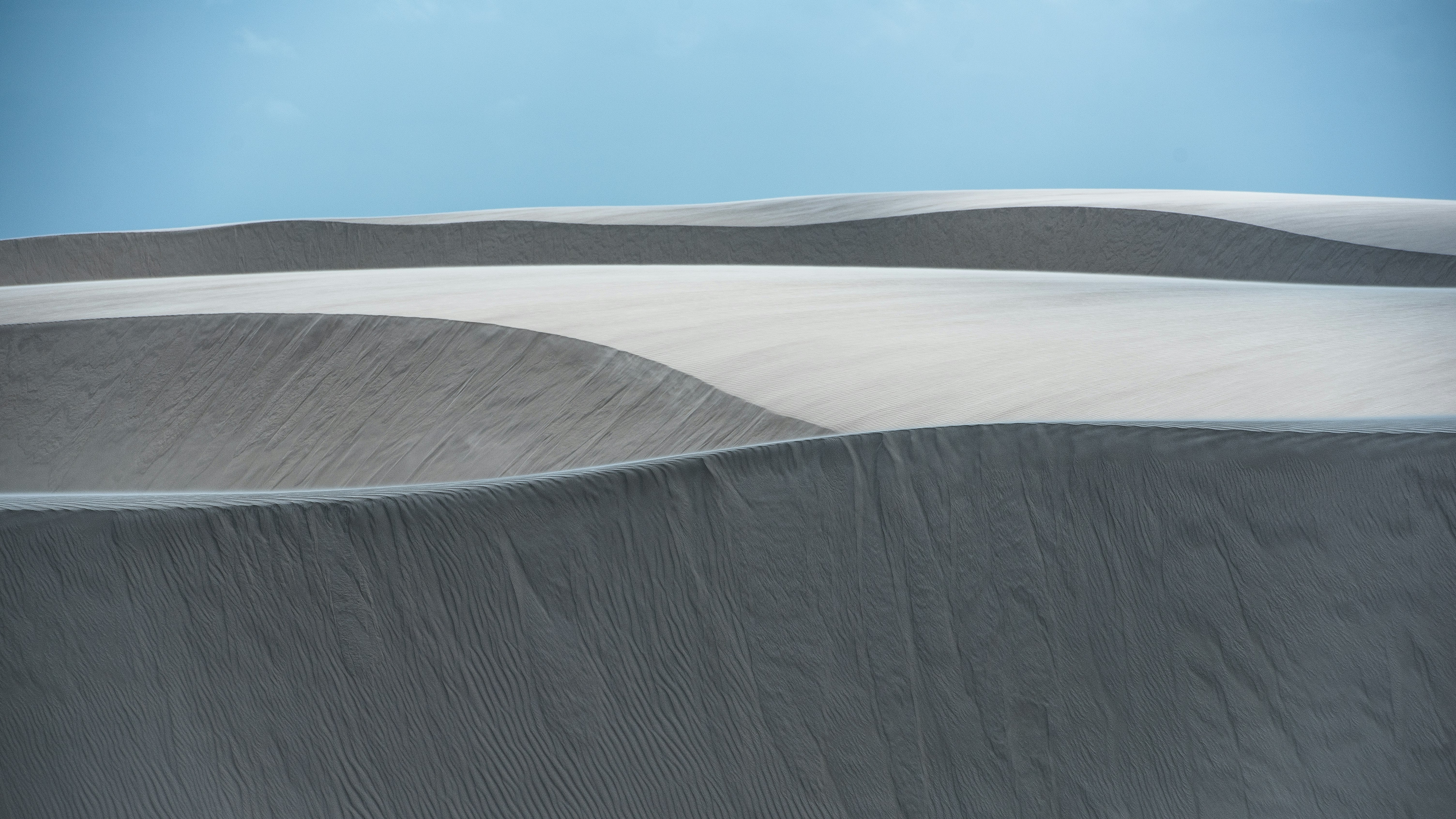 brown sand under blue sky during daytime